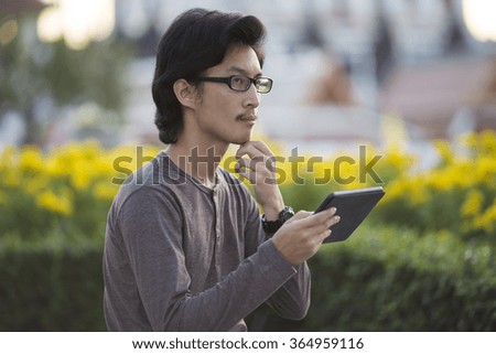 Man Use Tablet for Relaxation