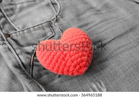 Valentine back ground of red heart hang on pocket jean