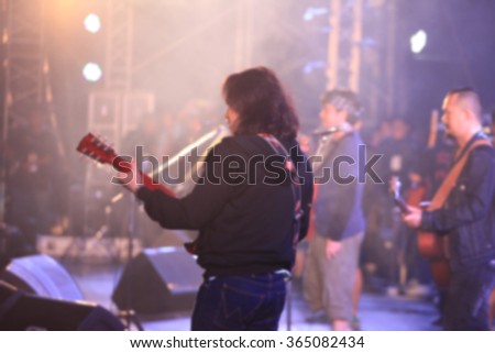 blurred singer and musician on concert