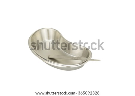 Stainless steel blade in kidney-shaped bowl placed supine isolated on white background. Healthcare and medical concepts photography.