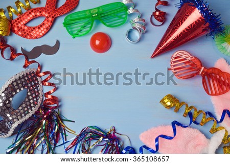 Carnival  background with mask, costume and glasses. View from above