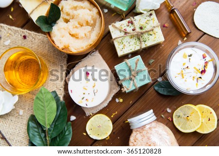 close up of body care cosmetic products on wood Royalty-Free Stock Photo #365120828