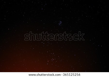 many glowing colorful stars in the sky at night