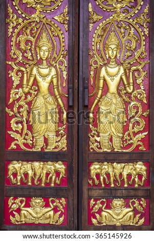 public women on door wood at temple , Chiang Mai  , Thailand