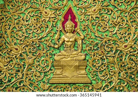 public gold buddha carved at temple , Chiang Mai  , Thailand / Narayana