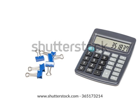 Office or home calculator with blue binder clips isolated on white