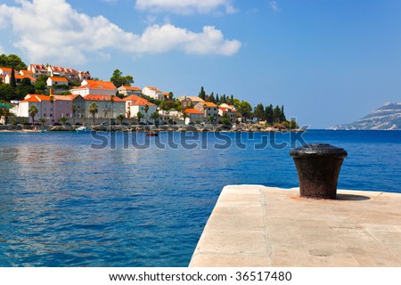 Pier and town - abstract travel background