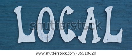 A sign reading local on a blue background