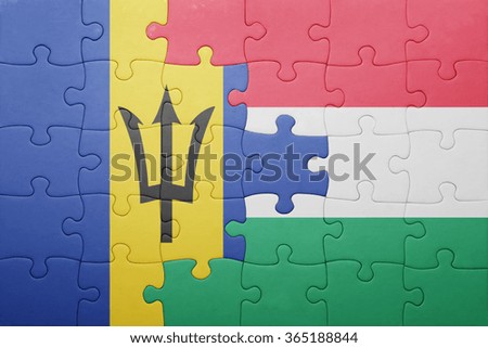 puzzle with the national flag of barbados and hungary . concept
