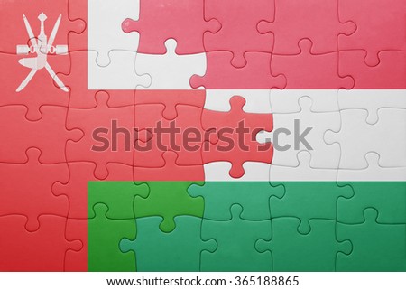 puzzle with the national flag of oman and hungary . concept