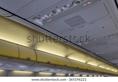 Italy, airplane cabin with no smoking sign on