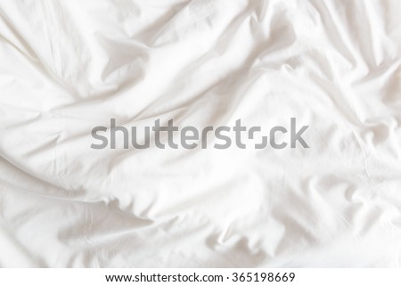 Top view of the crease of an unmade bed sheet in the bedroom after a long night sleep and waking up in the morning. Royalty-Free Stock Photo #365198669