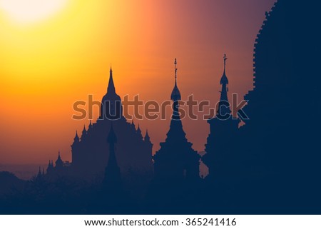 Amazing misty sunrise colors and silhouette of ancient Buddhist Temples at Bagan Kingdom, Myanmar (Burma). Travel landscapes and destinations