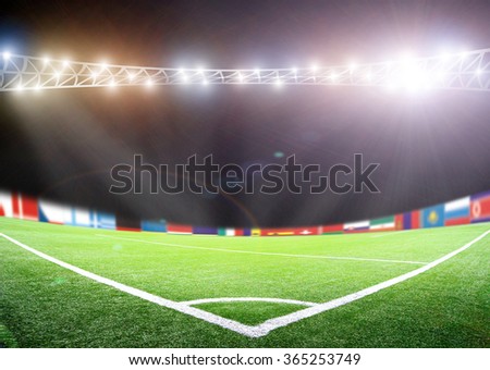 Bright lights at night and big soccer stadium