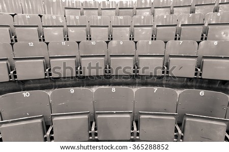 Vintage black and white picture of hockey arena benches