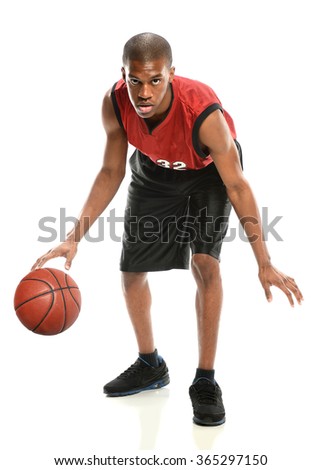 African American basketball player dribbling ball isolated over white background