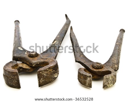 photo of the two old rusty pliers against the white background