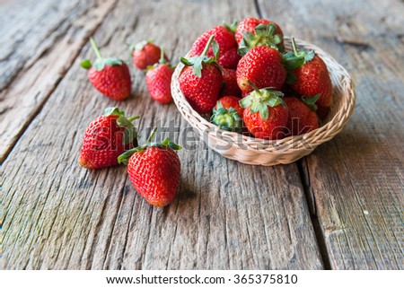 Strawberry over Wooden Background.