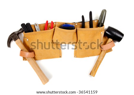 A brown leather toolbelt with assorted tools including a hammer, screwdrivers, pliers, tape measure etc. Royalty-Free Stock Photo #36541159