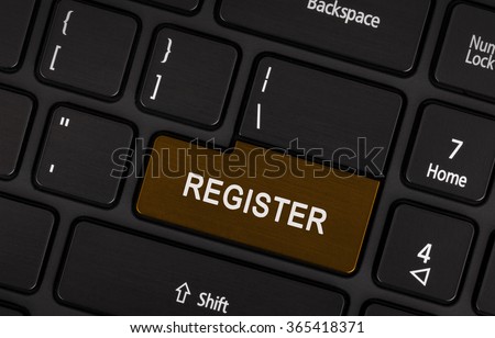 Brown register button on laptop keyboard close-up