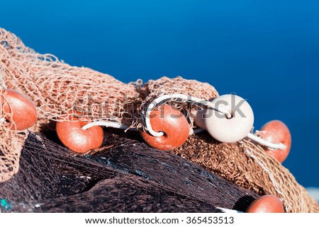 Detail of a Fishing Net / Close up of a fishing net with ropes and floats in the harbor