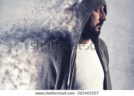 Adult bearded caucasain man dissolving under stress, conceptual image