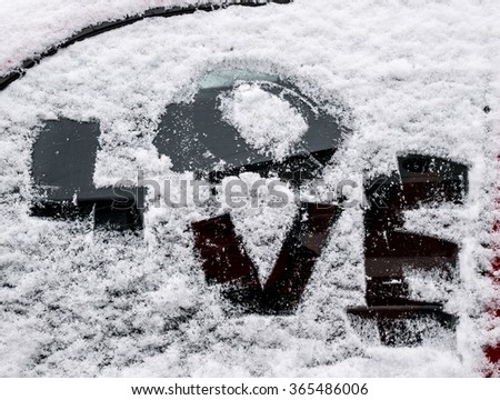  text love on a  frosty car window