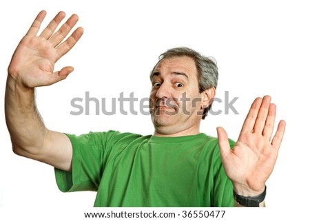 silly mature man making stop with his hands