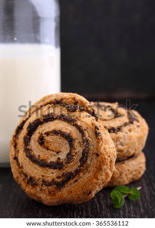 Cookies with poppy seeds and a glass of milk