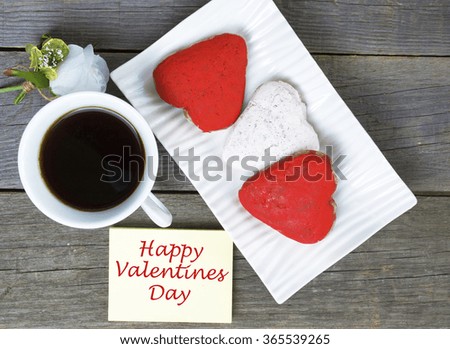 Heart shaped cookies , cup of coffee, white rose decoration, coffee maker. Romantic or Valentine's Day Breakfast. Toned, selected focus image