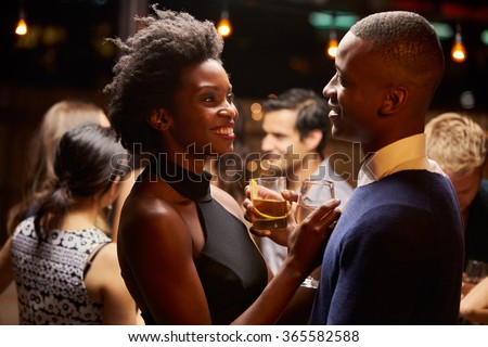Couples Dancing And Drinking At Evening Party Royalty-Free Stock Photo #365582588