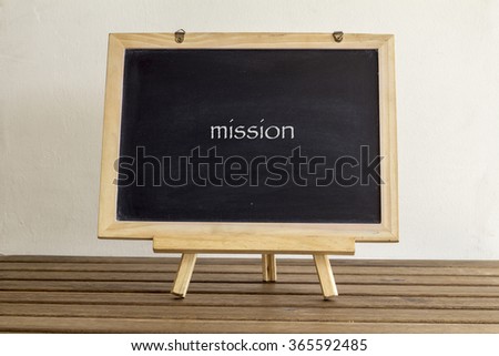 blank small blackboard on the wooden table