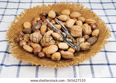 brazil nut, walnuts, almonds and hazelnuts in a basket