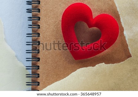Sketch book with red heart on white paper background. For love message or valentine's day