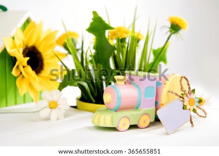 toy train and a drum on the background of grass
