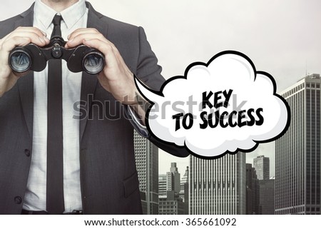 Key to success text on speech bubble with businessman holding binoculars