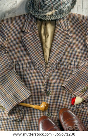 Londoners acessories - hat . tweed jacket, smoking pipe, pasport,lighter