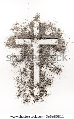 Christian cross symbol made of ash on a white background