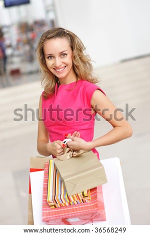 Woman with bags in shopping mall