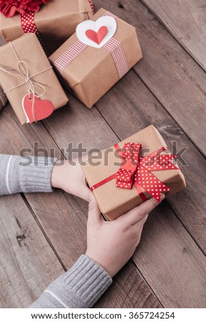 Hands holding a valentine's gift box 