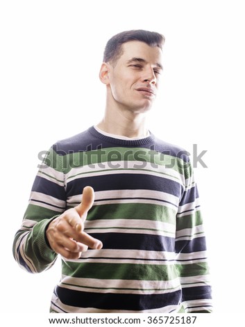 Portrait of a smart serious young man standing against white background. Emotional concept for gesture