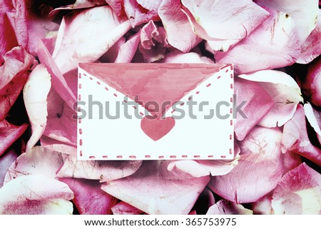 Love letter on Background the petals of roses.