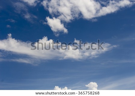 Masses of  majestic white fluffy cumulus  congestus or towering cumulus ice cream  clouds  with rainy nimbus in a blue Australian sky in mid summer  indicate stormy  showery weather ahead.
