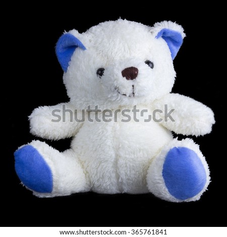 teddy bear isolated on dark background