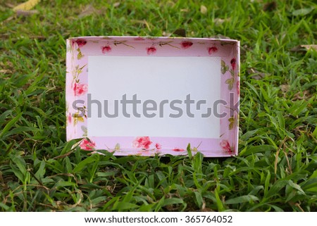 picture frame pink flower in green garden