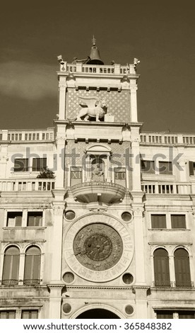 St Mark's Clocktower with Zodiac clock and Winged Lion. Piazza San Marco in Venice (Italy). Aged photo. Sepia.