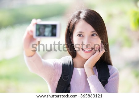 young woman traveler happy smile take selfie. nature green background, asian beauty