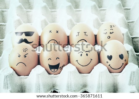 Vintage Eight brown eggs with faces drawn arranged in carton