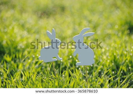 Easter rabbits decorations in fresh spring grass