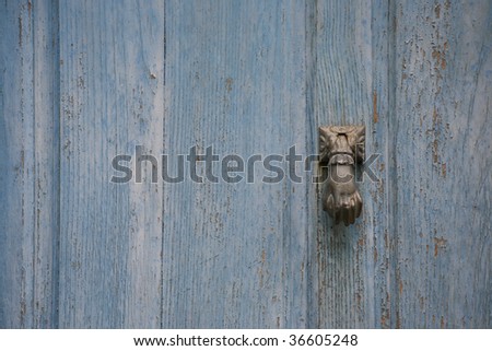 Old wooden door with bronze knocker Royalty-Free Stock Photo #36605248